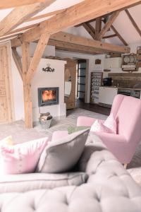 a living room with a couch and a fireplace at Gipfelkönig in Bayrischzell +40 photos