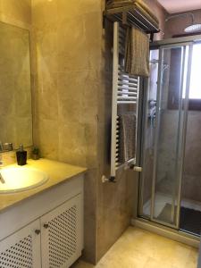 a bathroom with a sink and a shower at Casa Calida in Murcia