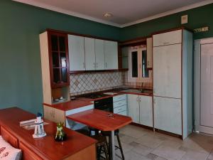 A kitchen or kitchenette at Edem Studios and Apartments