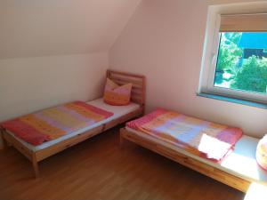 Кровать или кровати в номере Ferienhaus Ebenheit am Lilienstein