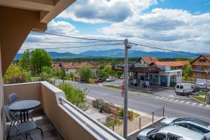 a balcony with a view of a city street at Apartmani Hadžić in Živinice