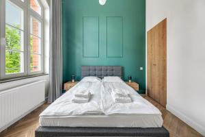 Posteľ alebo postele v izbe v ubytovaní Apartments Waterlane Vintage & by Noclegi Renters