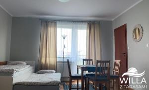 Postel nebo postele na pokoji v ubytování Willa z Tarasami