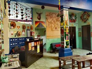 a room with a table and a pole in it at The Roof Backpackers in Guadalajara +72 photos