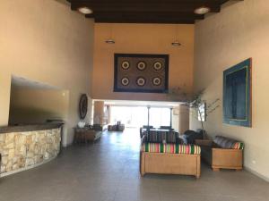 Et tv og/eller underholdning på Marupiara Suítes Muro alto Apts 319 e 224