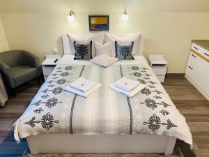 Posteľ alebo postele v izbe v ubytovaní Apartamenty u Magika