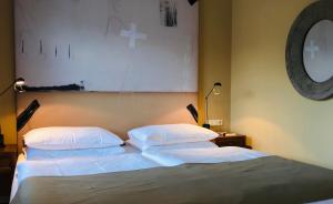 Postel nebo postele na pokoji v ubytování Strandhotel Margaretha