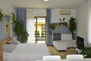Postel nebo postele na pokoji v ubytování STM3 Apartman