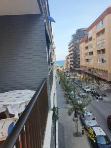 a balcony of a building with a street with cars at Frontimar in Calpe