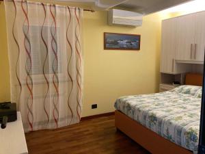Posteľ alebo postele v izbe v ubytovaní La casa delle streghette