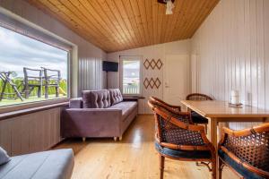 a living room with a couch and a table at Nameliai pas Jolita in Palanga