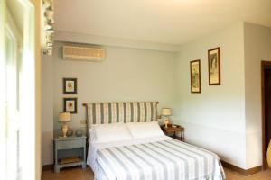 Postel nebo postele na pokoji v ubytování Villa Pardi