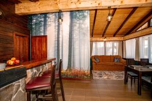 a living room with a couch and a table at Апартаменти Стара Ворохта in Vorokhta