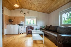 a living room with a couch and a table at Nameliai pas Jolita in Palanga