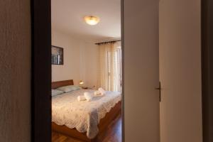 Postel nebo postele na pokoji v ubytování Apartman Budimir1