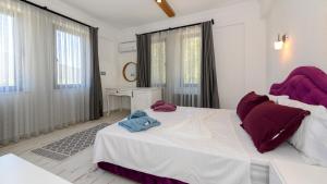 เตียงในห้องที่ Kaya Köy'de Özel Havuzlu, 5 Yatak Odalı Lüks Villa Albera +69 ภาพ