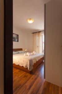 Postel nebo postele na pokoji v ubytování Apartman Budimir1