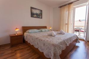 Postel nebo postele na pokoji v ubytování Apartman Budimir1