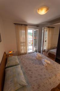 Postel nebo postele na pokoji v ubytování Apartman Budimir1