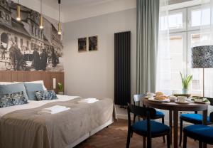 En eller flere senge i et værelse på Starowislna 77