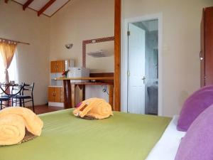 Cama o camas de una habitación en Cabañas Rapa Nui Orito