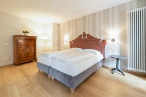 Posteľ alebo postele v izbe v ubytovaní Antico Borgo B&B Cannobio