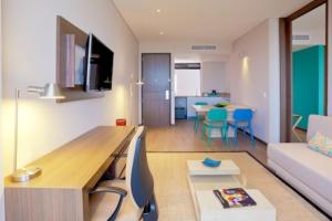 a living room with a couch and a table at Holiday Inn Express Yopal by IHG in Yopal