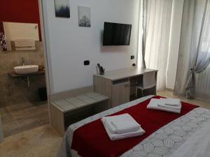 Postel nebo postele na pokoji v ubytování Don Nino