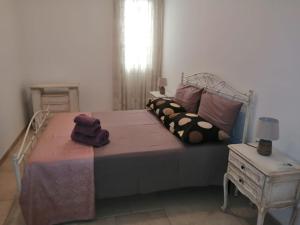 A bed or beds in a room at La Nuova Casetta