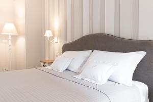 Posteľ alebo postele v izbe v ubytovaní Antico Borgo B&B Cannobio