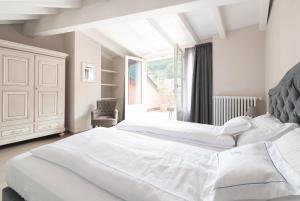 Posteľ alebo postele v izbe v ubytovaní Antico Borgo B&B Cannobio