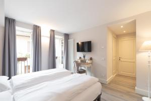 Posteľ alebo postele v izbe v ubytovaní Antico Borgo B&B Cannobio