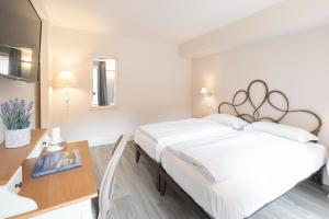 Posteľ alebo postele v izbe v ubytovaní Antico Borgo B&B Cannobio