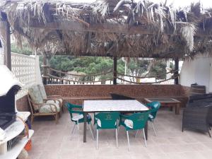 a patio with a table and chairs on a patio at La Manga Cala Del Pino in La Manga del Mar Menor