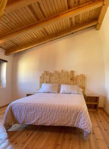 Säng eller sängar i ett rum på La bicicleta del Moncayo