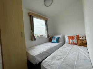 Cama ou camas em um quarto em Ocean Edge Holiday Park