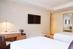 Postel nebo postele na pokoji v ubytování Concorde Hotel New York