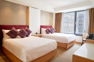 Postel nebo postele na pokoji v ubytování Concorde Hotel New York