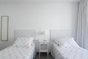 Posteľ alebo postele v izbe v ubytovaní Amarre Paradise