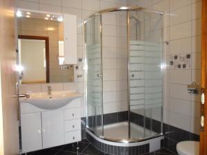 a bathroom with a shower and a sink at Apartments Maria in Tisno