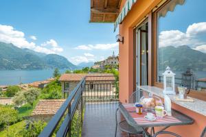 a balcony with a table and a view of the water at Casa Bellavista Wi-Fi Parking Free in San Siro