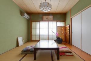 a dining room with a table in a room at KB1*Unique HUGE house for family /JR +subway in Osaka