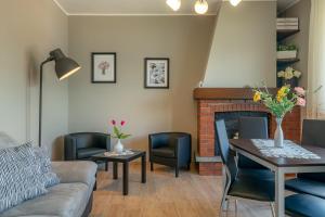 a living room with a couch and a fireplace at Casa Bellavista Wi-Fi Parking Free in San Siro