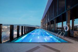 a swimming pool on the roof of a building at bai Hotel Cebu in Cebu City