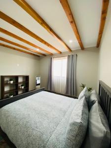 Postel nebo postele na pokoji v ubytování Villa Macrina