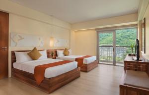 Voodi või voodid majutusasutuse Pico Sands Hotel toas