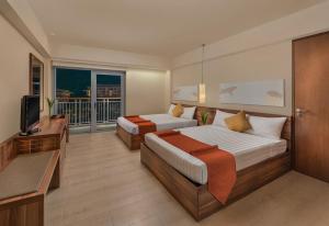 Voodi või voodid majutusasutuse Pico Sands Hotel toas