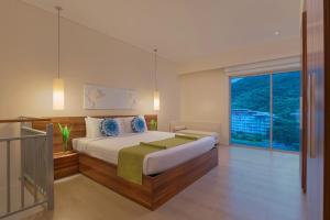 Voodi või voodid majutusasutuse Pico Sands Hotel toas