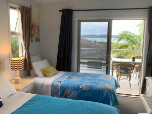 A bed or beds in a room at Amazing Seaview House