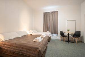 Postel nebo postele na pokoji v ubytování Bridge Hotel